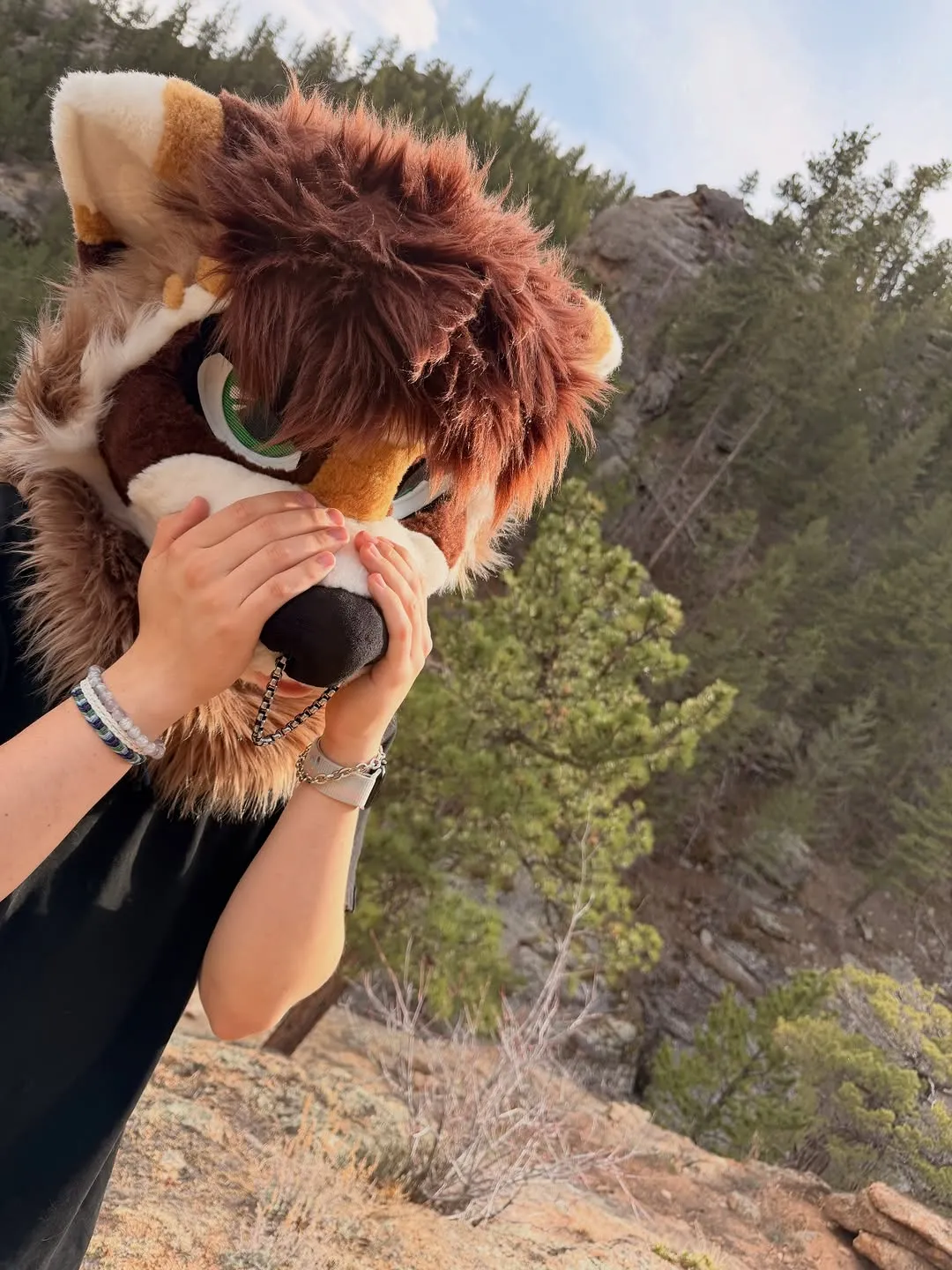 Photo by spoon on April 09, 2026. May be an image of fox, binoculars, headdress, fur, glasses and text.